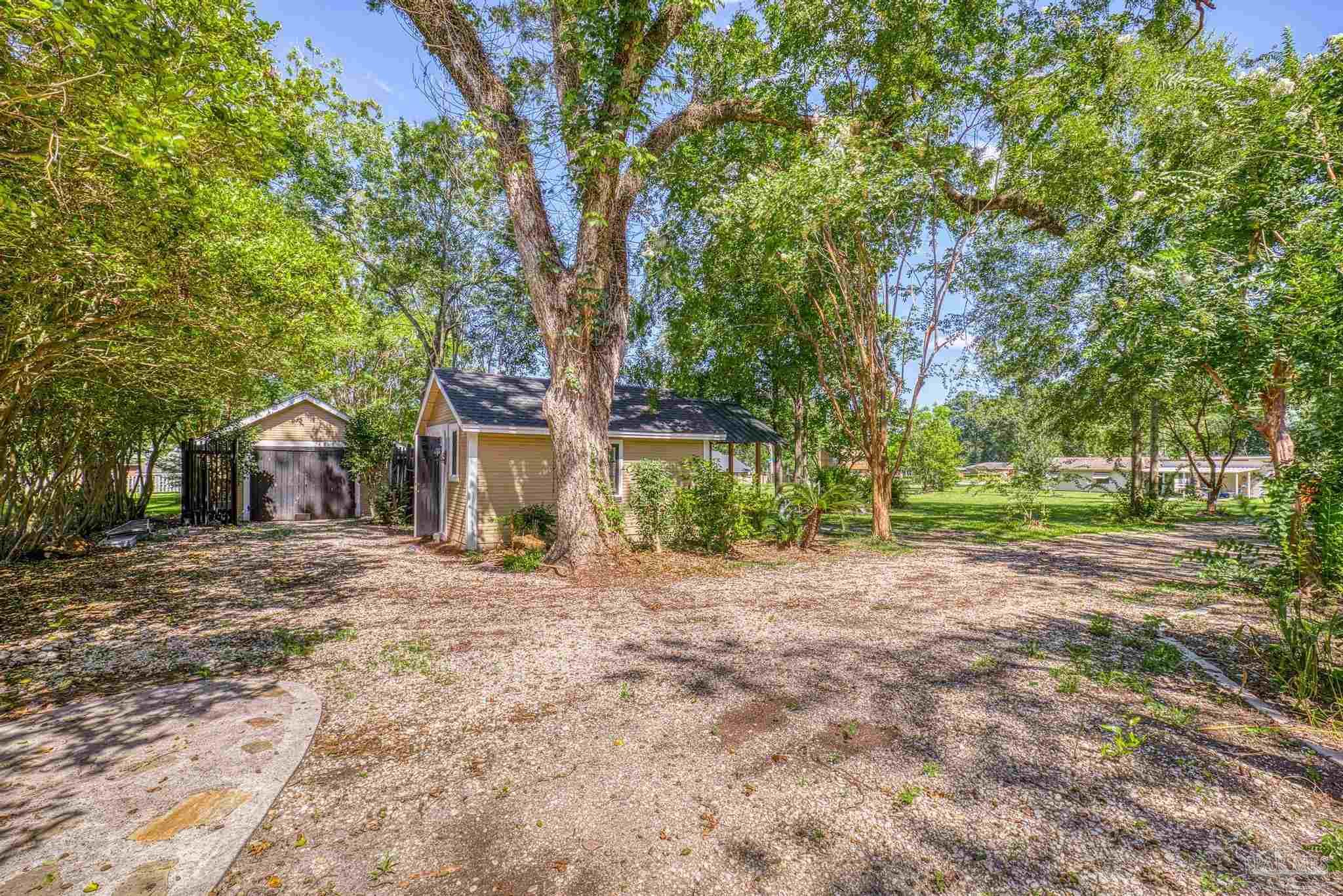 1701 Sowell Road Brewton, AL 36426 - Photo 8 of 72 a big house with trees in front of it