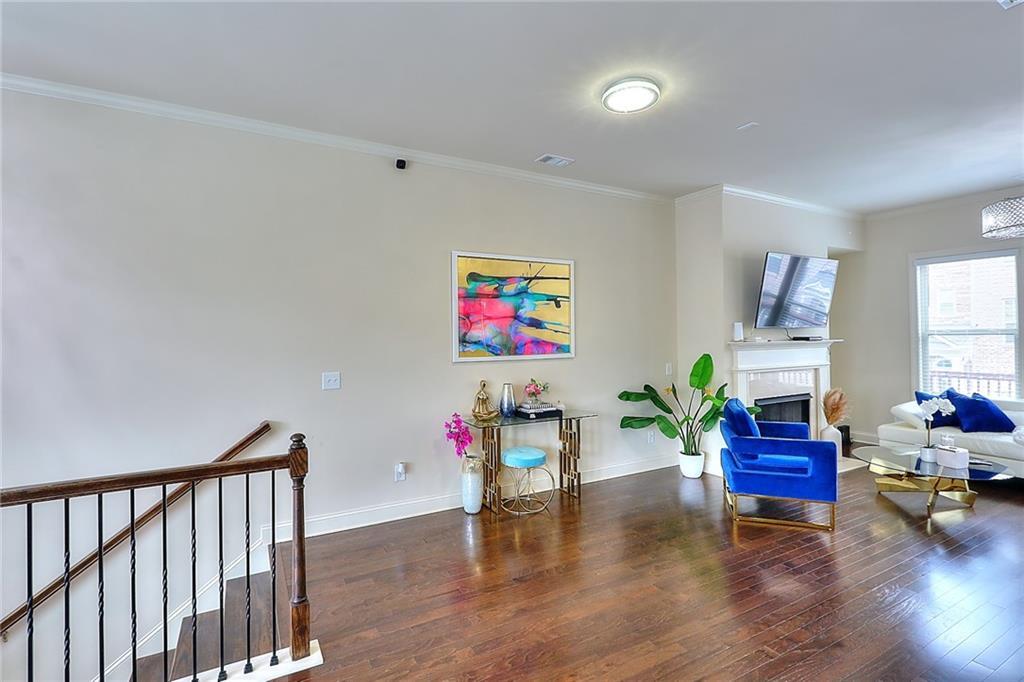 1306 Harris Way South Atlanta, GA 30319 - Photo 6 of 19 a living room with furniture and wooden floor