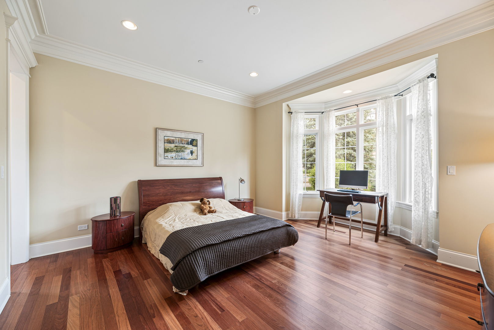 3372 Lakeside Avenue Northbrook, IL 60062 - Photo 15 of 41 a bedroom with a bed and wooden floor
