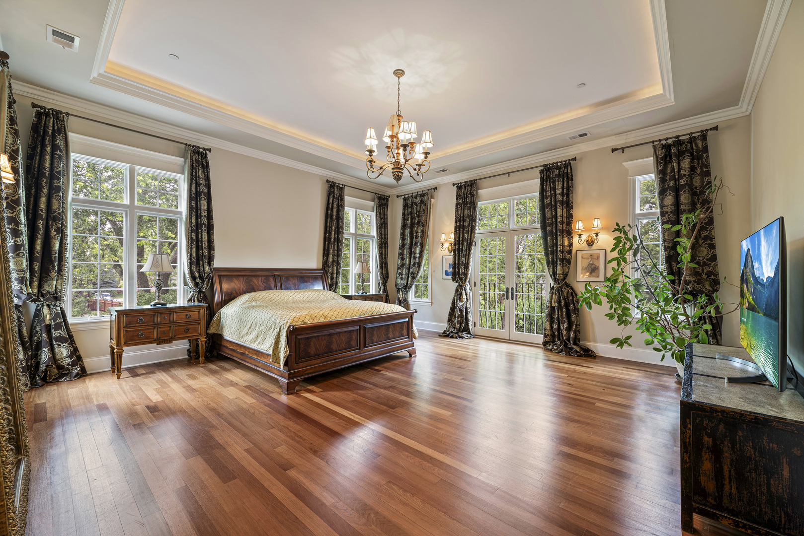 3372 Lakeside Avenue Northbrook, IL 60062 - Photo 18 of 41 a bedroom with a large bed and a flat tv screen on dresser