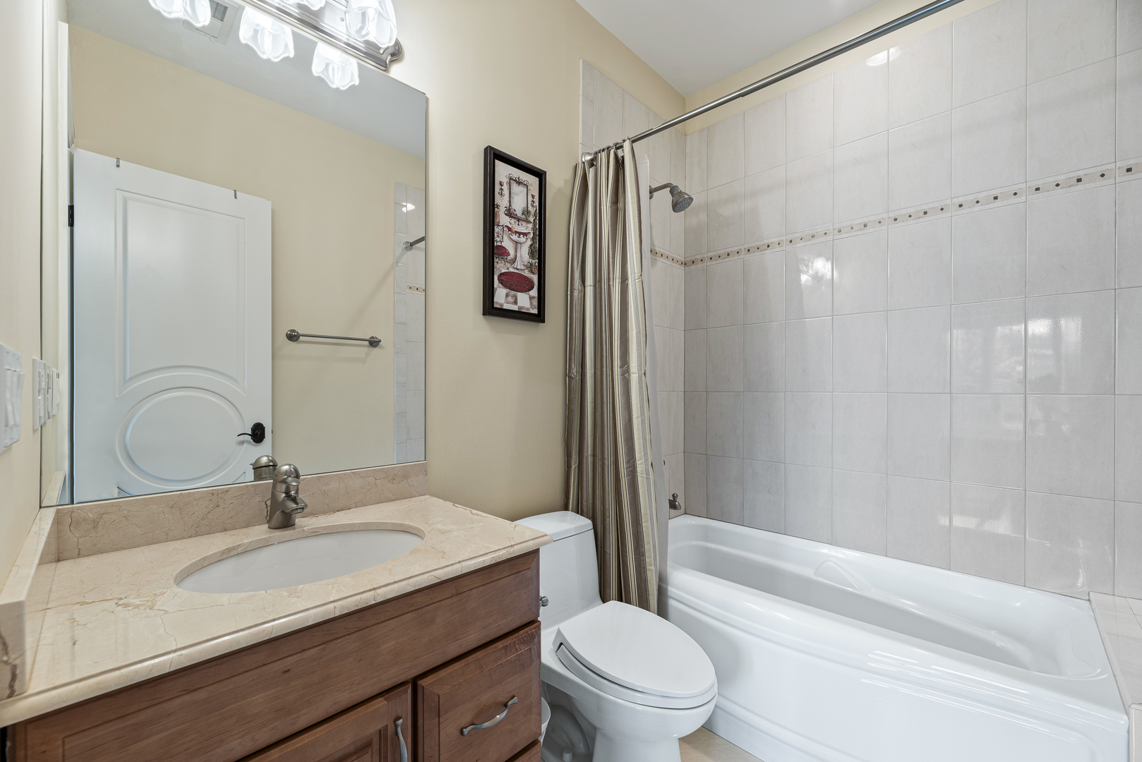 3372 Lakeside Avenue Northbrook, IL 60062 - Photo 25 of 41 a bathroom with a sink toilet a mirror and shower