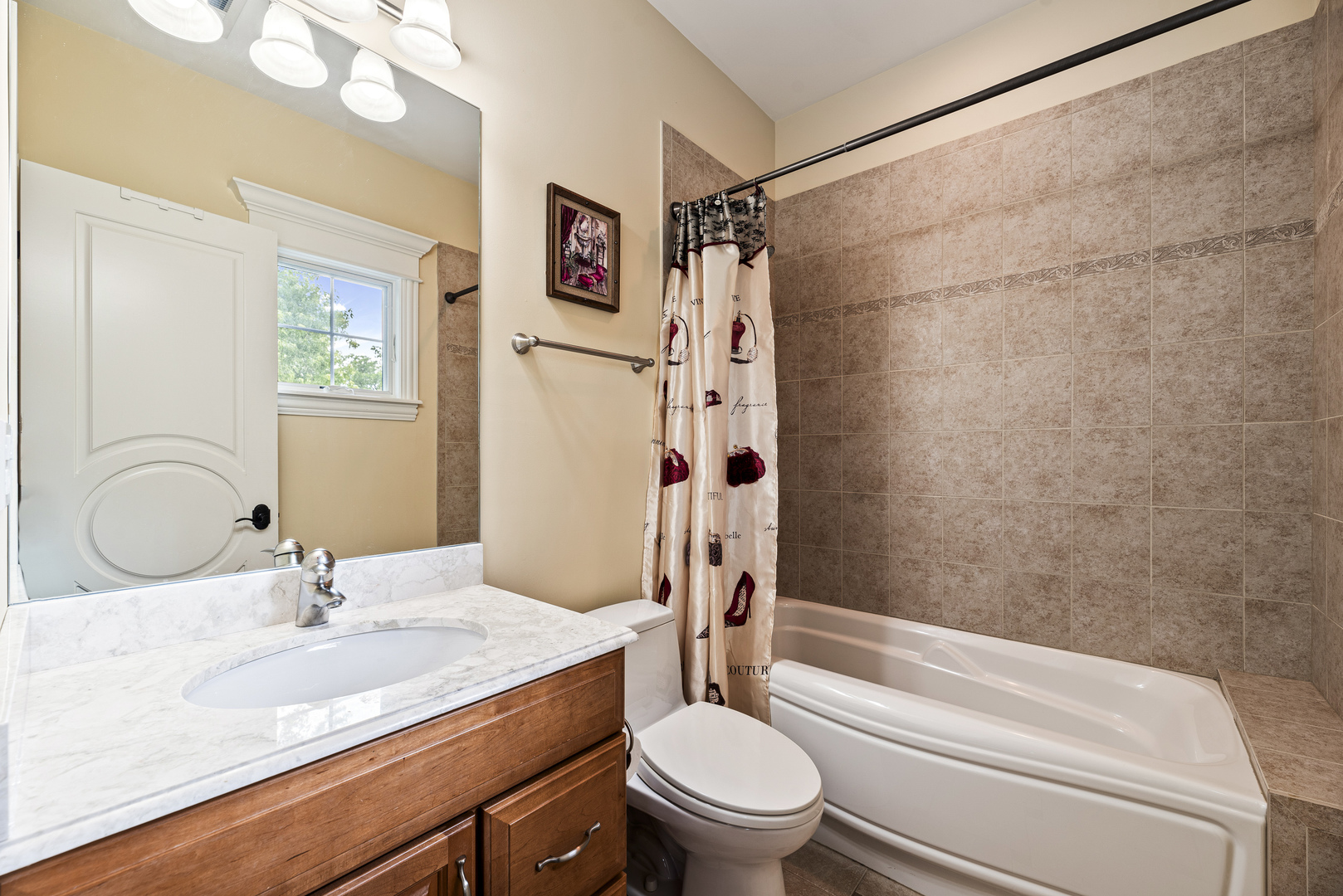 3372 Lakeside Avenue Northbrook, IL 60062 - Photo 27 of 41 a bathroom with a granite countertop toilet sink and shower