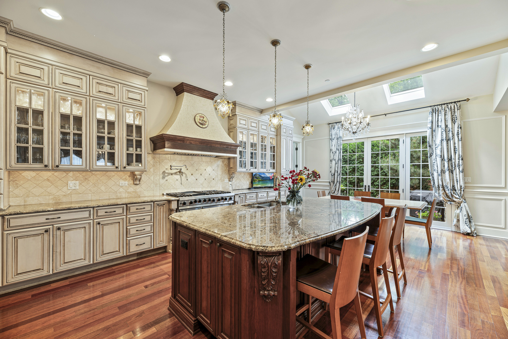 3372 Lakeside Avenue Northbrook, IL 60062 - Photo 8 of 41 a kitchen with stainless steel appliances granite countertop a sink a stove and a wooden floors
