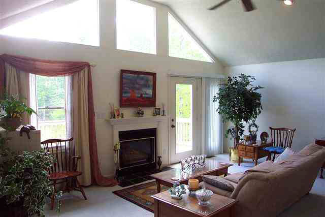 2395 Paddock Wood Road Keswick, VA 22947 - Photo 4 of 5 a living room with furniture a window and a fireplace