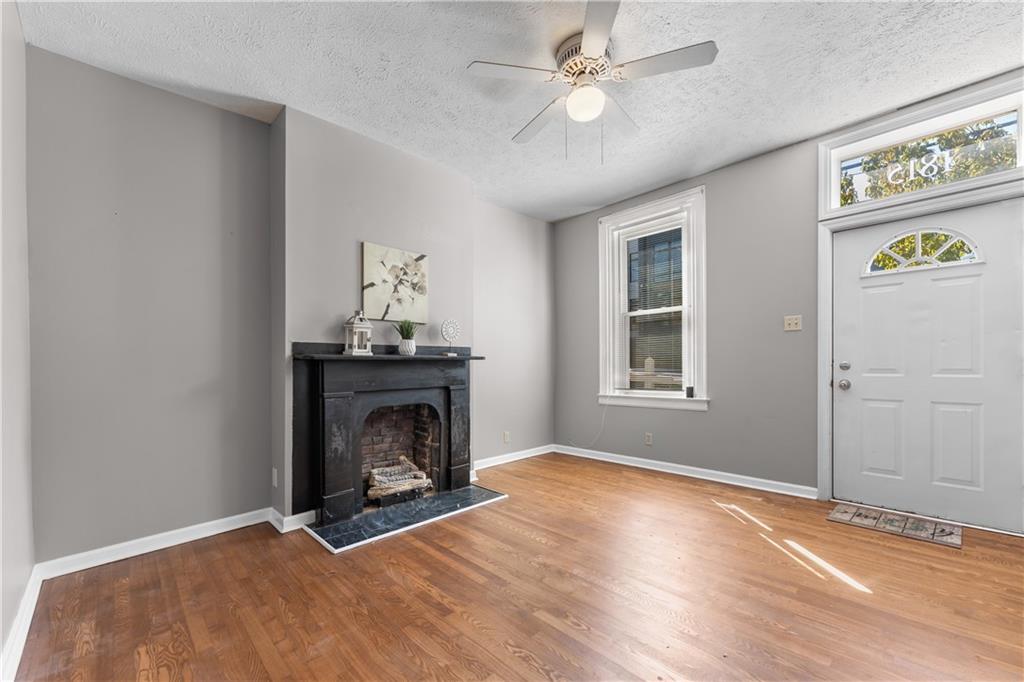 1815 Wharton Street Pittsburgh, PA 15203 - Photo 2 of 15 a view of an empty room with window and fireplace