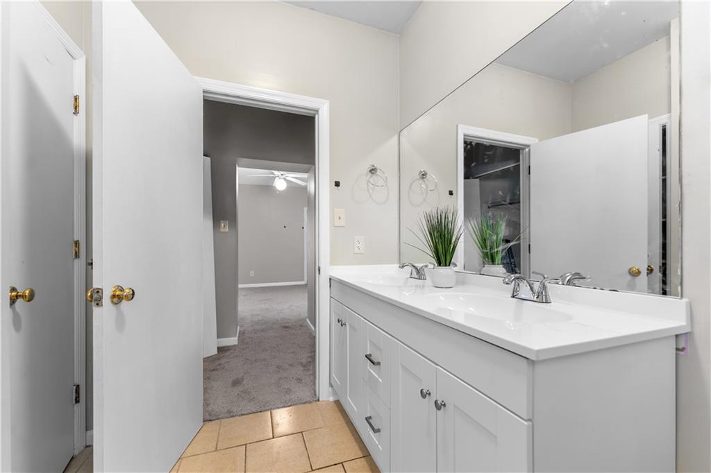 1815 Wharton Street Pittsburgh, PA 15203 - Photo 8 of 15 a bathroom with a sink and a mirror