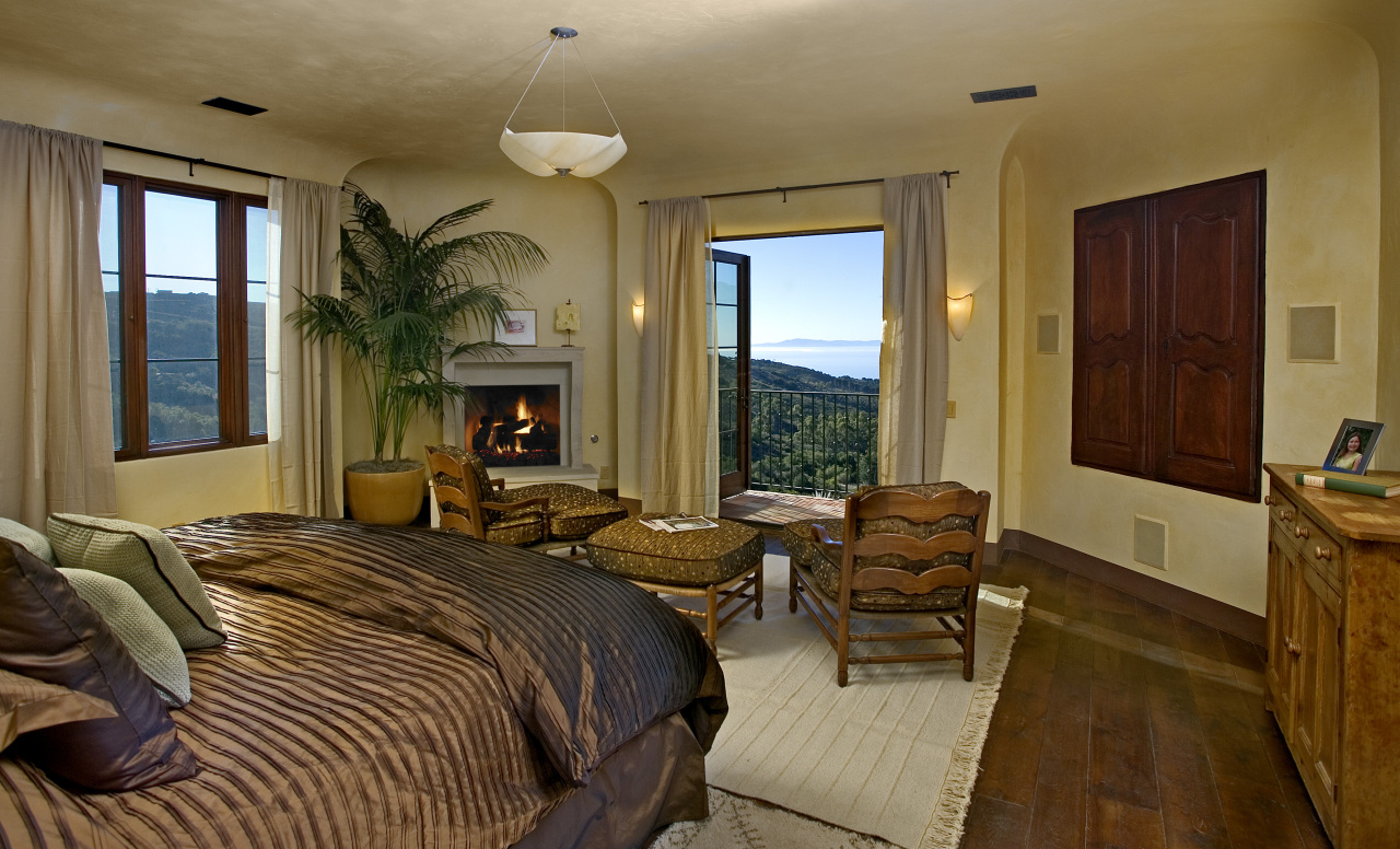 891 Toro Canyon Road Montecito, CA 93108 - Photo 7 of 11 a bedroom with a bed and large windows