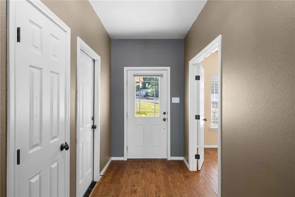 a view of an empty room with a window
