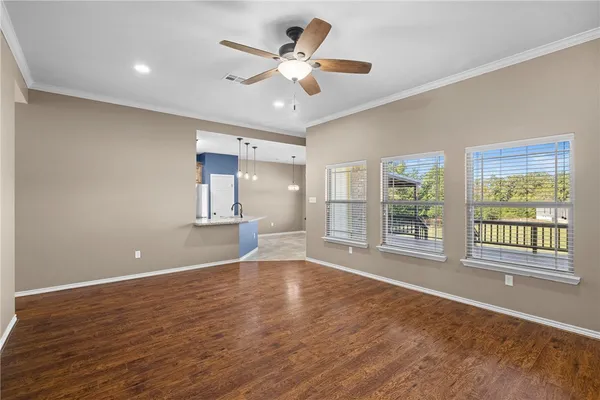a bathroom with a granite countertop toilet and a sink