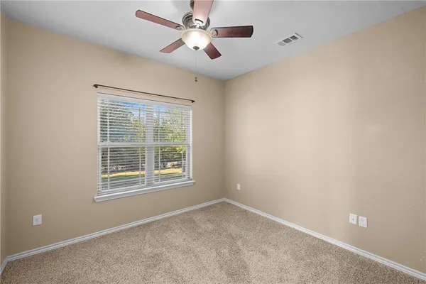 a kitchen with stainless steel appliances granite countertop a refrigerator a stove and a sink with granite countertops