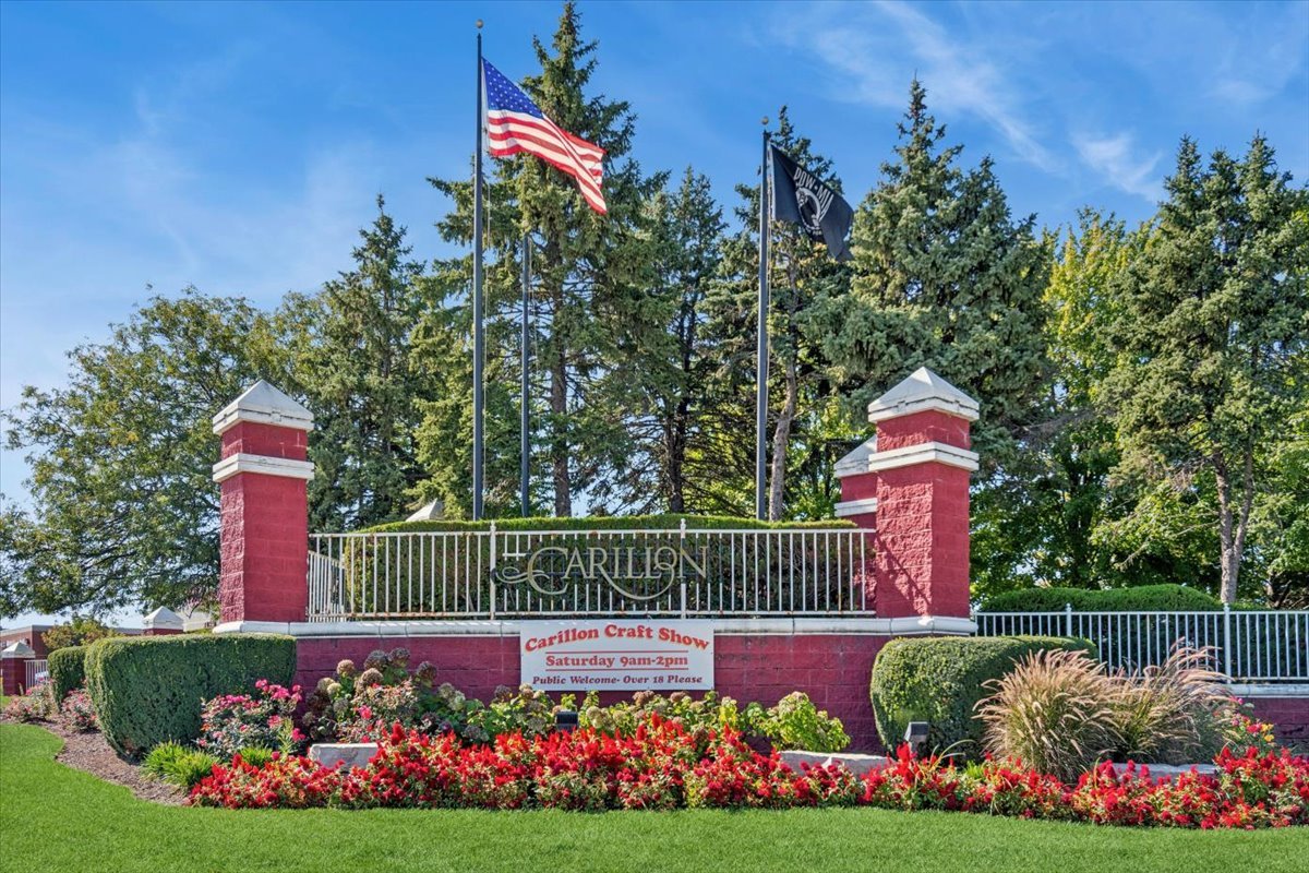 20928 West Spruce Lane Plainfield, IL 60544 - Photo 20 of 20 a sign that is in front of flowers