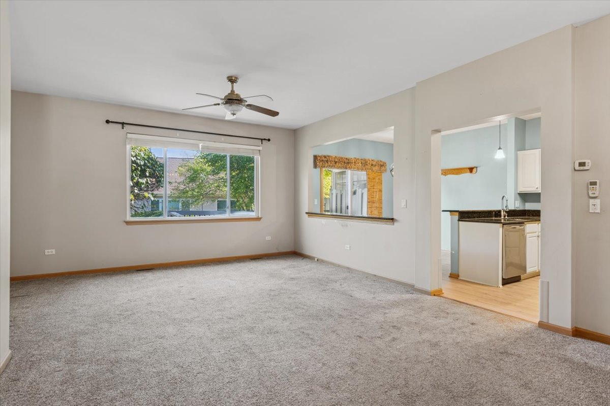 20928 West Spruce Lane Plainfield, IL 60544 - Photo 4 of 20 an empty room with windows and cabinet