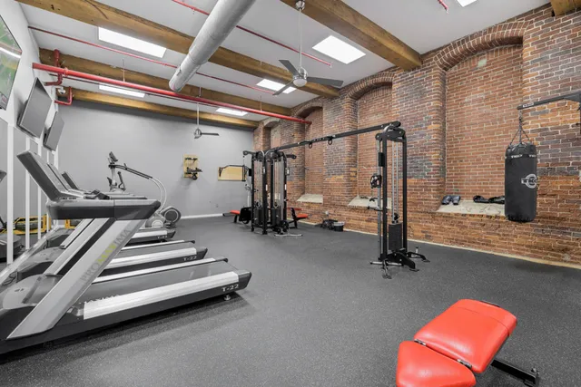a room with pool table and windows