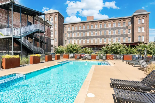 a view of a swimming pool with a patio