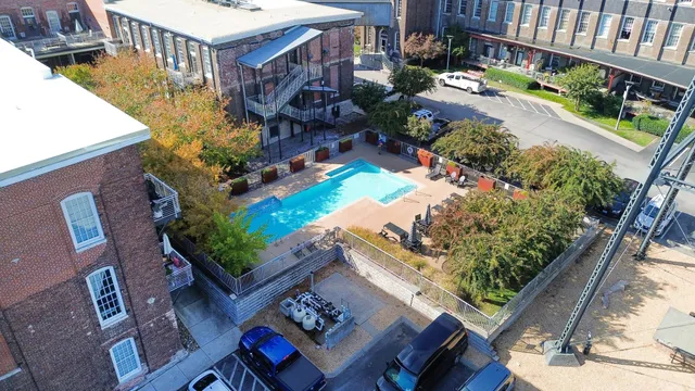 a view of a backyard with wooden fence