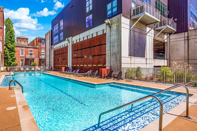 a view of a house with a wooden fence