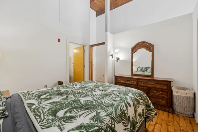 a bedroom with a bed and a dresser