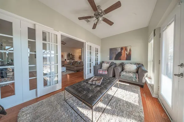 a living room with furniture and a rug