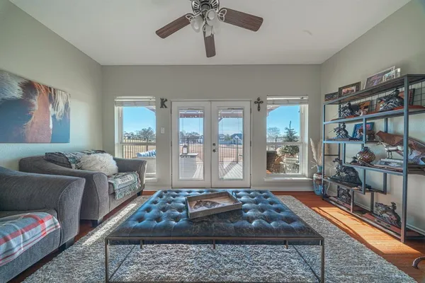 a large bedroom with furniture and a window