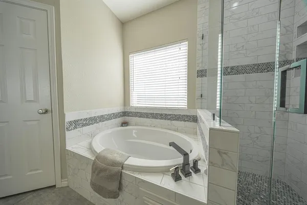 a bath tub sitting next to a window