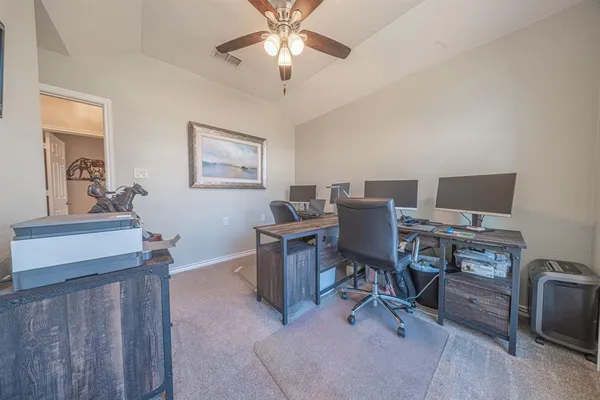 a view of a workspace with furniture