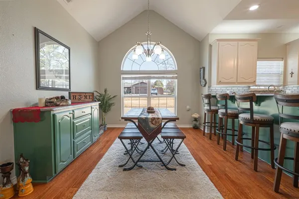 a dining room with furniture and window