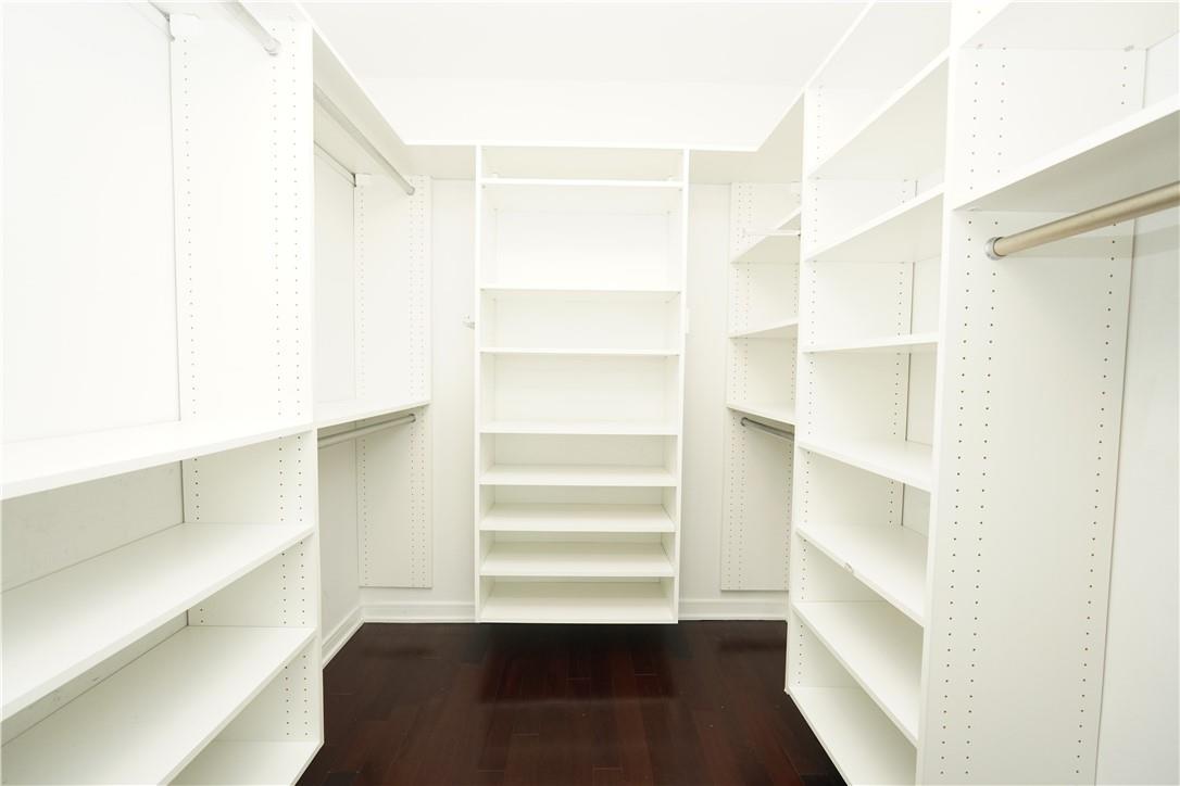207 East 57th Street, Unit 21B Manhattan, NY 10022 - Photo 11 of 12 a view of walk in closet with empty racks
