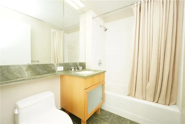 a bathroom with a sink a toilet and a bathtub