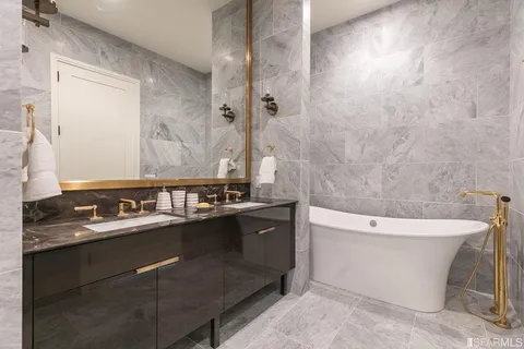 a bathroom with a bathtub sink and toilet