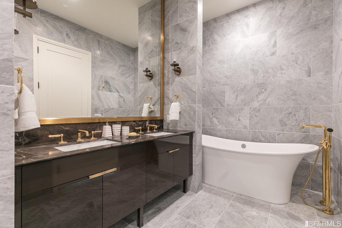 288 Pacific Avenue, Unit 2H San Francisco, CA 94111 - Photo 15 of 34 a bathroom with a bathtub sink and toilet