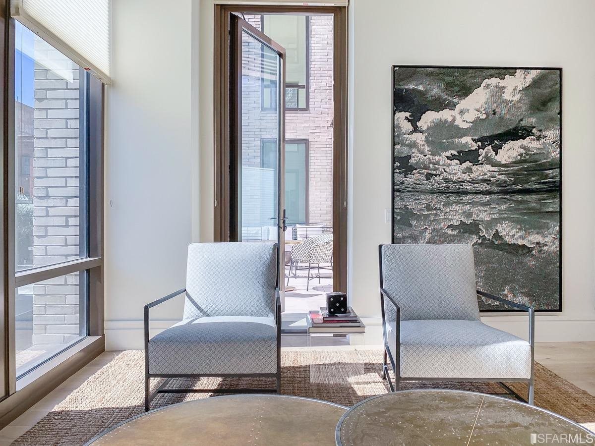 288 Pacific Avenue, Unit 2H San Francisco, CA 94111 - Photo 7 of 34 a living room with furniture and a painting on the wall