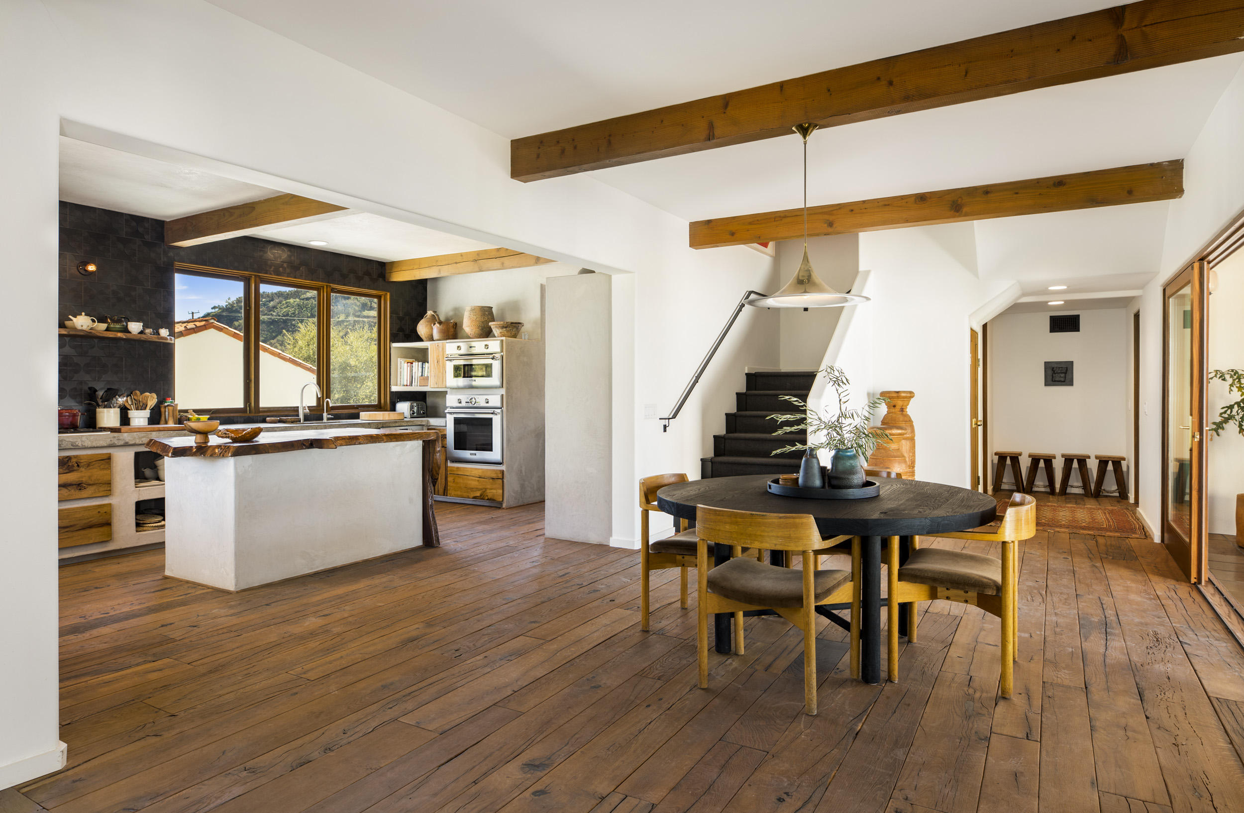 12980 Ojai Road Santa Paula, CA 93060 - Photo 15 of 32 a kitchen with stainless steel appliances kitchen island granite countertop a table chairs and a stove