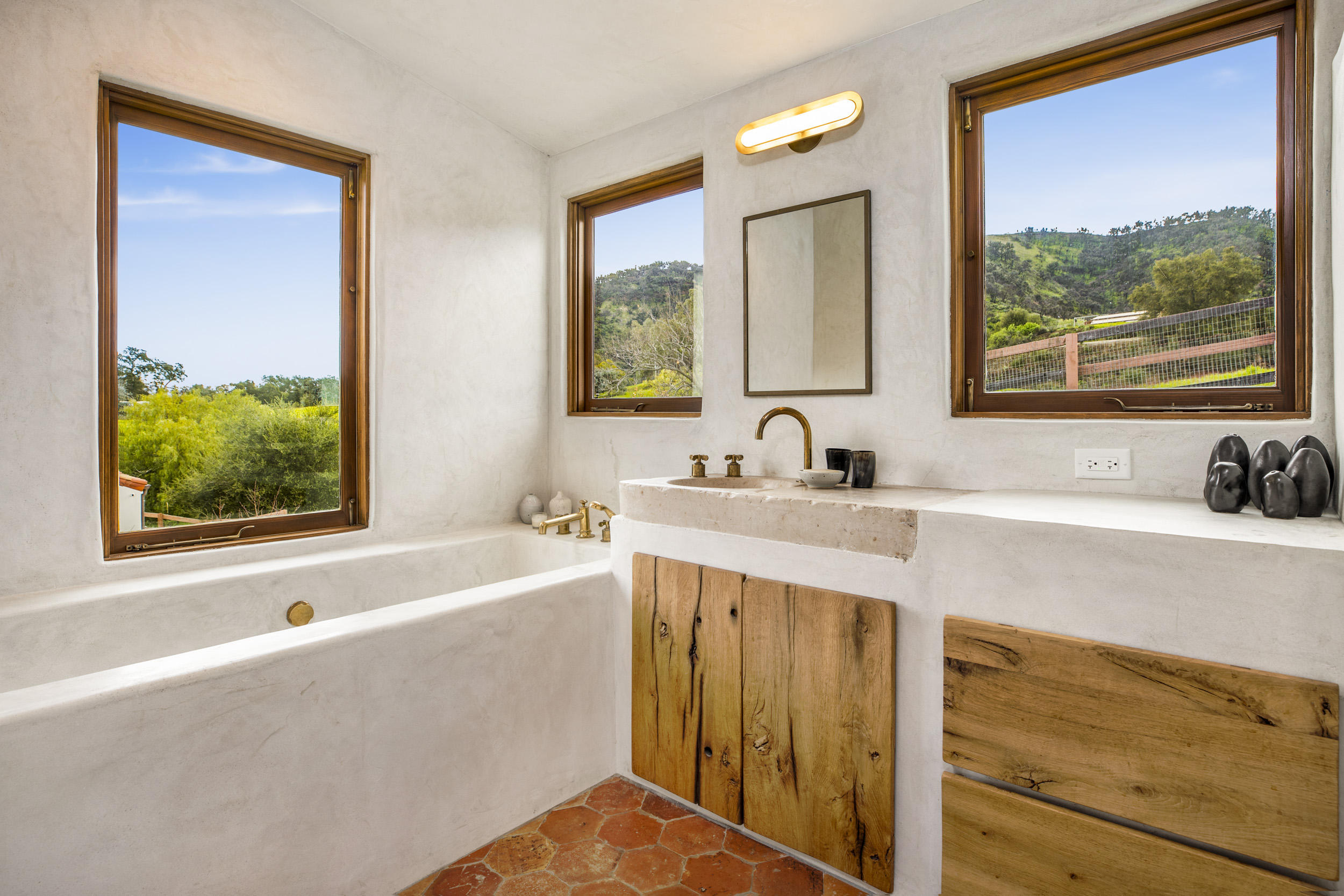 12980 Ojai Road Santa Paula, CA 93060 - Photo 20 of 32 a bathroom with a tub a sink and a window