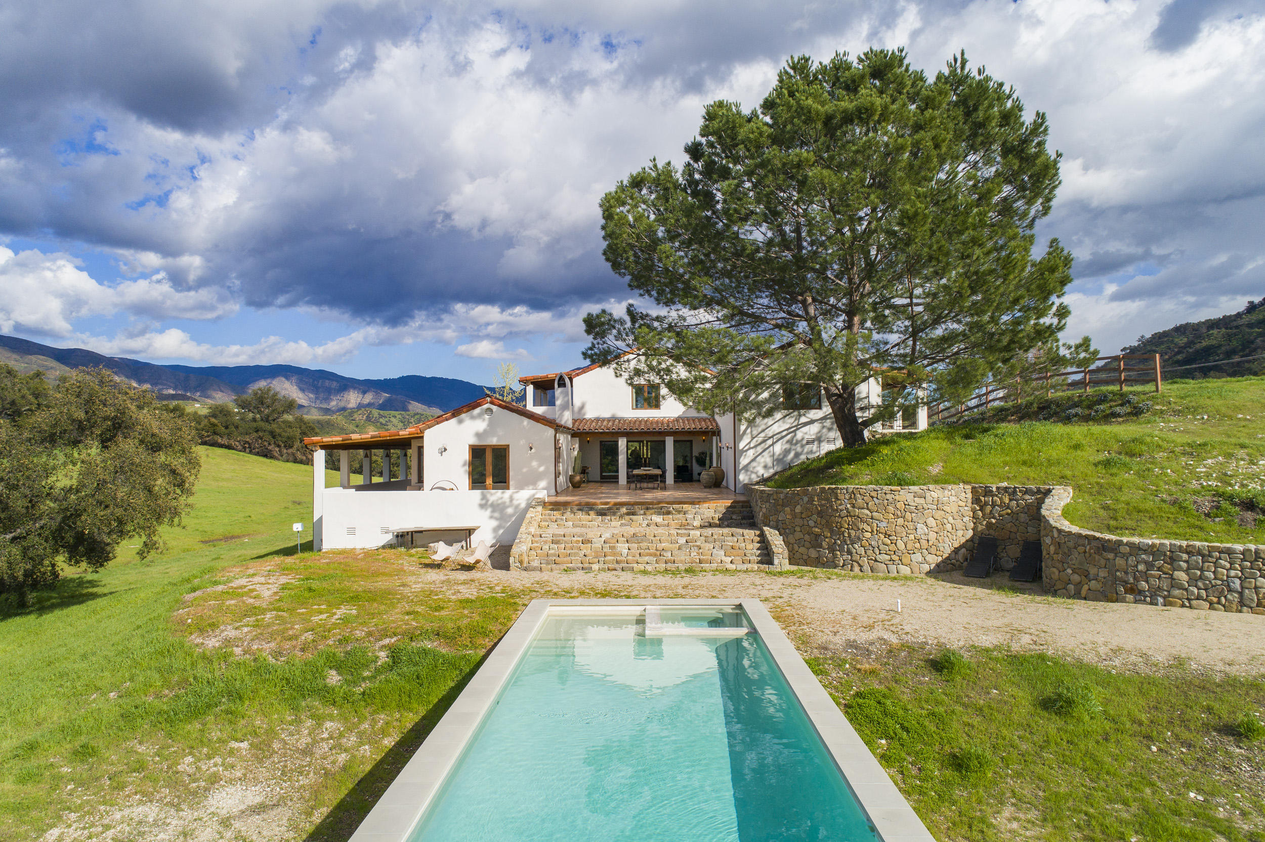12980 Ojai Road Santa Paula, CA 93060 - Photo 3 of 32 a view of an house with swimming pool garden and trees