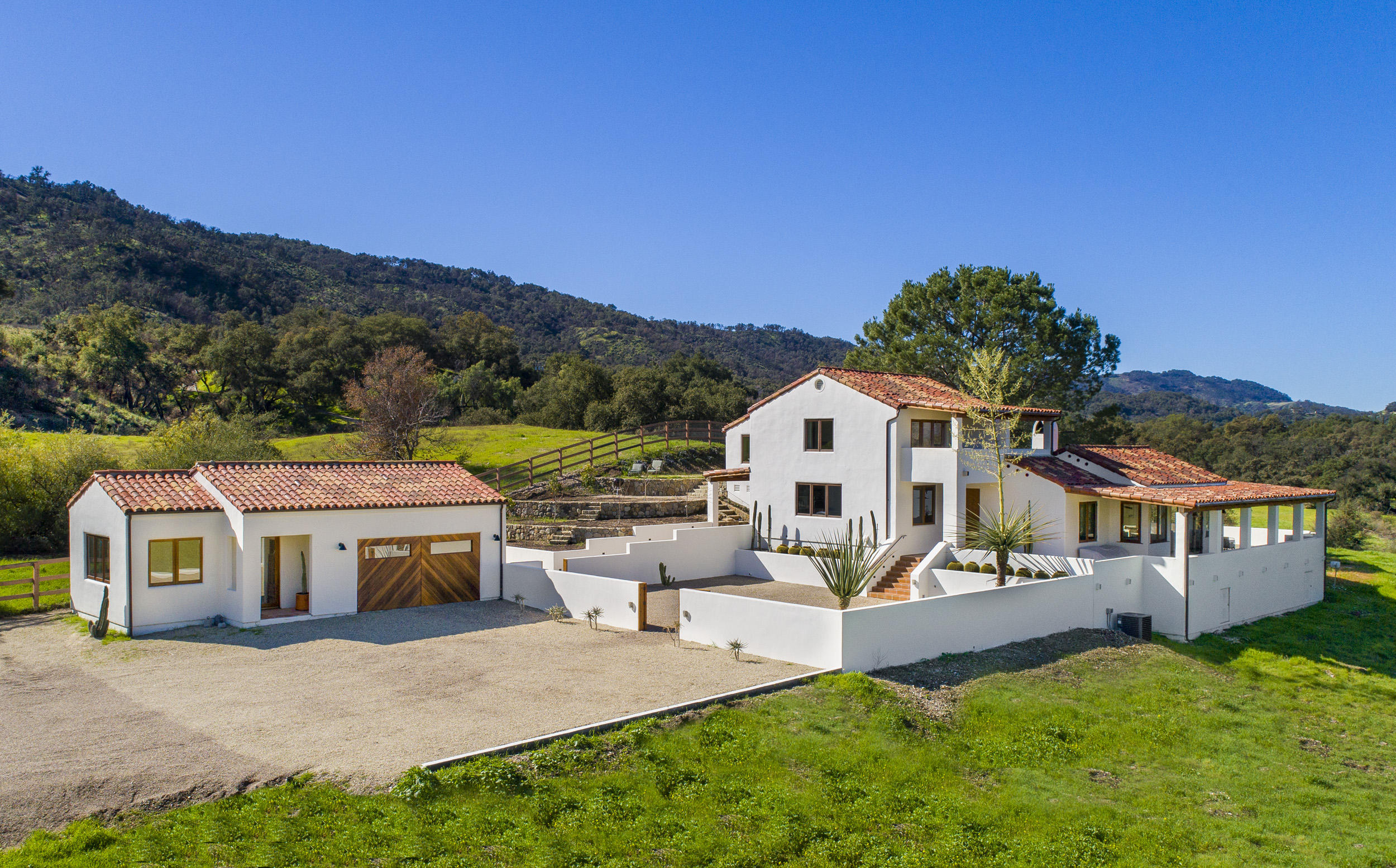 12980 Ojai Road Santa Paula, CA 93060 - Photo 4 of 32 a front view of a house with a yard table and chairs