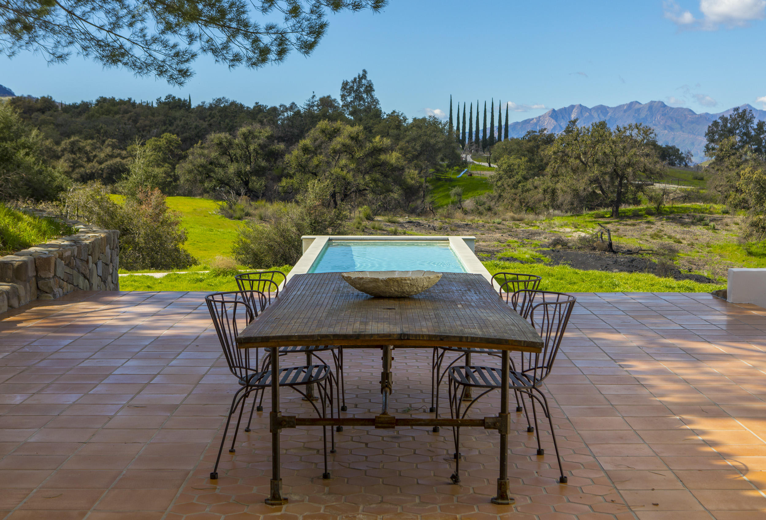 12980 Ojai Road Santa Paula, CA 93060 - Photo 6 of 32 a view of a chairs and table on the patio