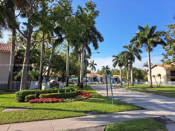 a front view of a building with garden