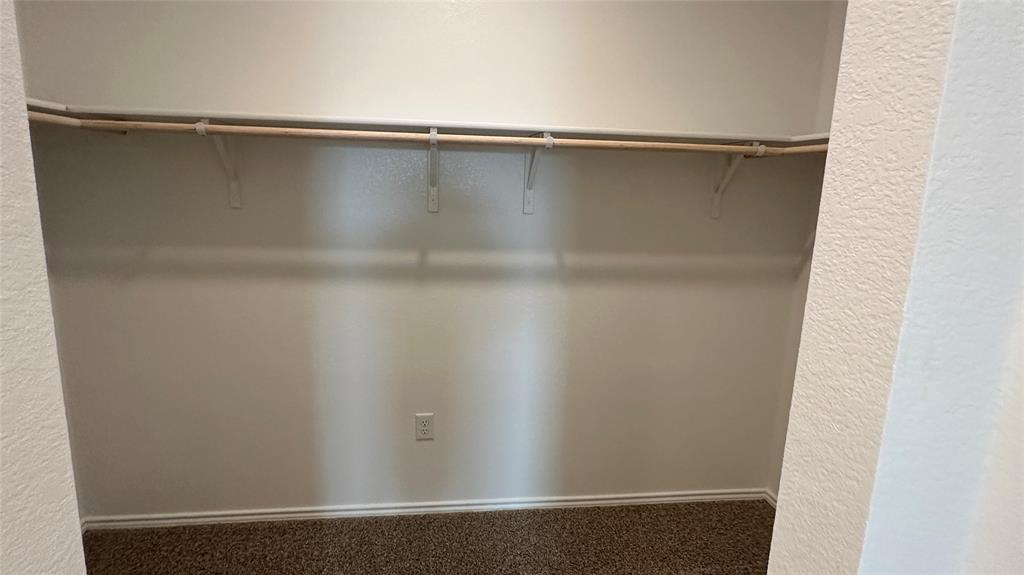 204 Inks Lane Kyle, TX 78640 - Photo 16 of 25 Ample closet space with shelving provides convenient storage.