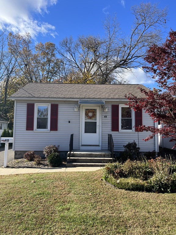 40 Price Street Springfield, MA 01104 - Photo 3 of 19 a front view of a house with a yard