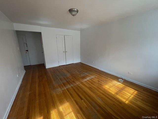 144-31 78th Road, Unit 3L Queens, NY 11367 - Photo 4 of 10 a view of a big room with wooden floor