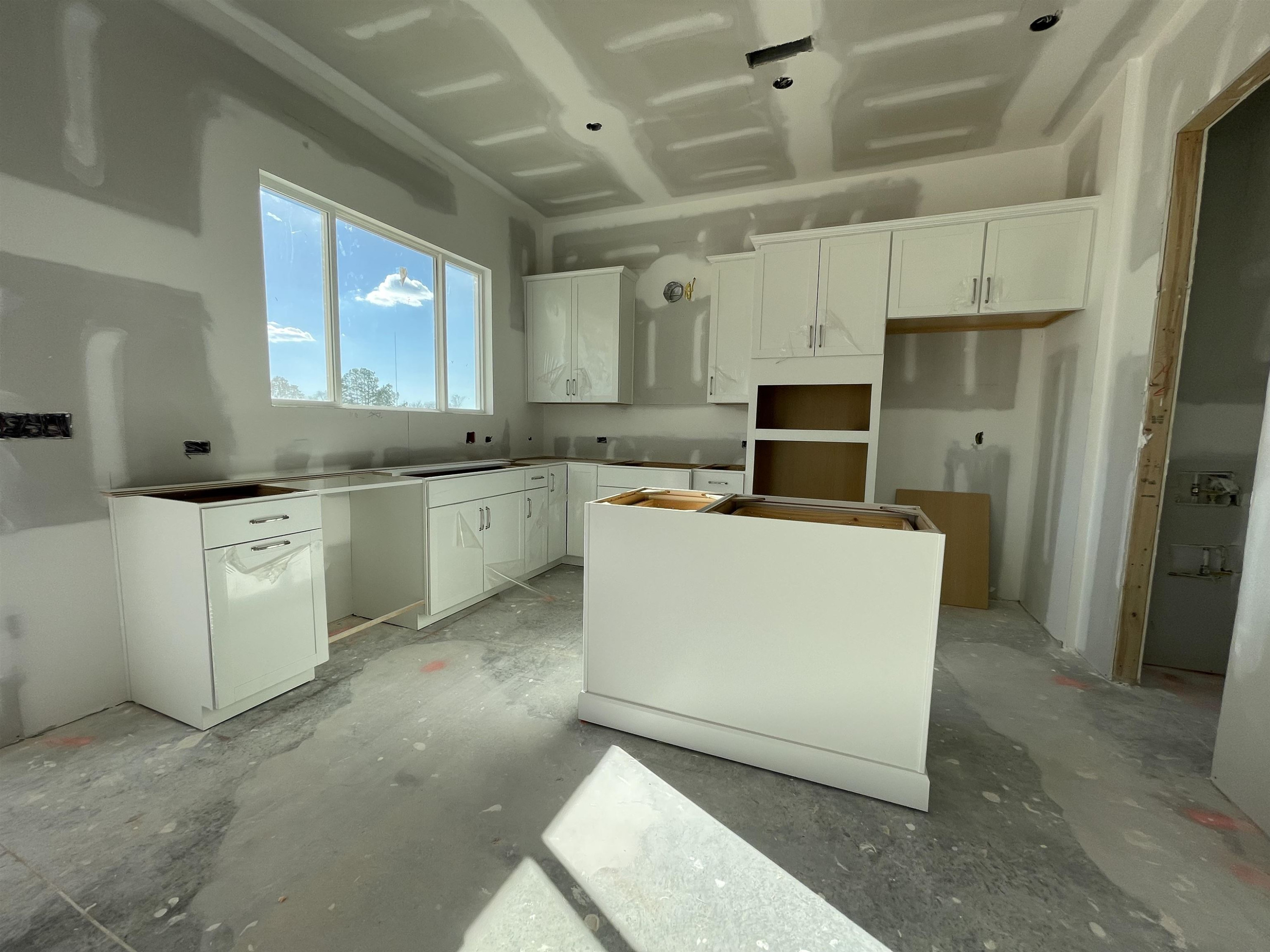 540 Marthas View Way Wake Forest, NC 27587 - Photo 13 of 25 a large kitchen with cabinets and stainless steel appliances