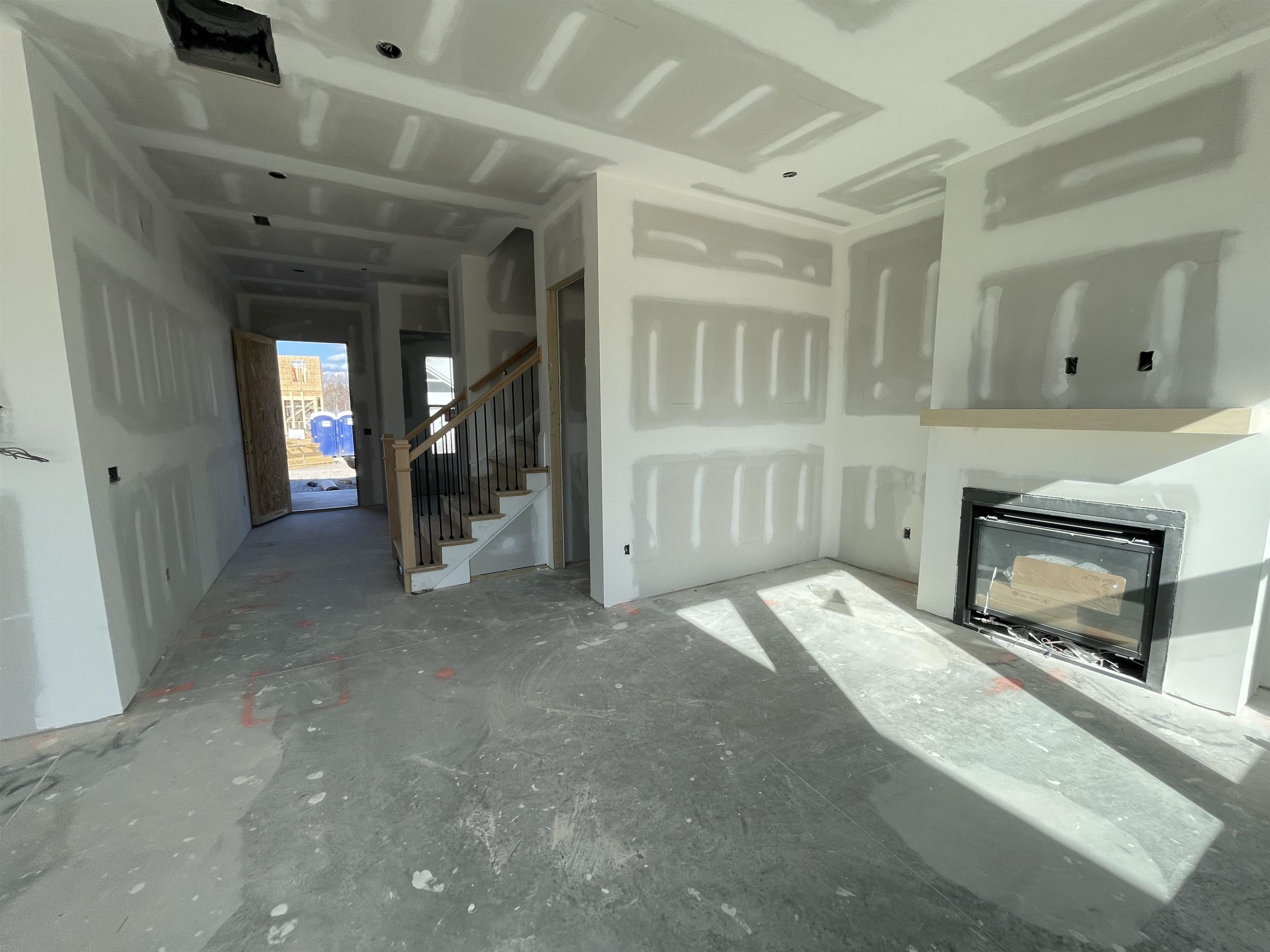 540 Marthas View Way Wake Forest, NC 27587 - Photo 16 of 25 a view of a hallway with wooden cabinet and fireplace