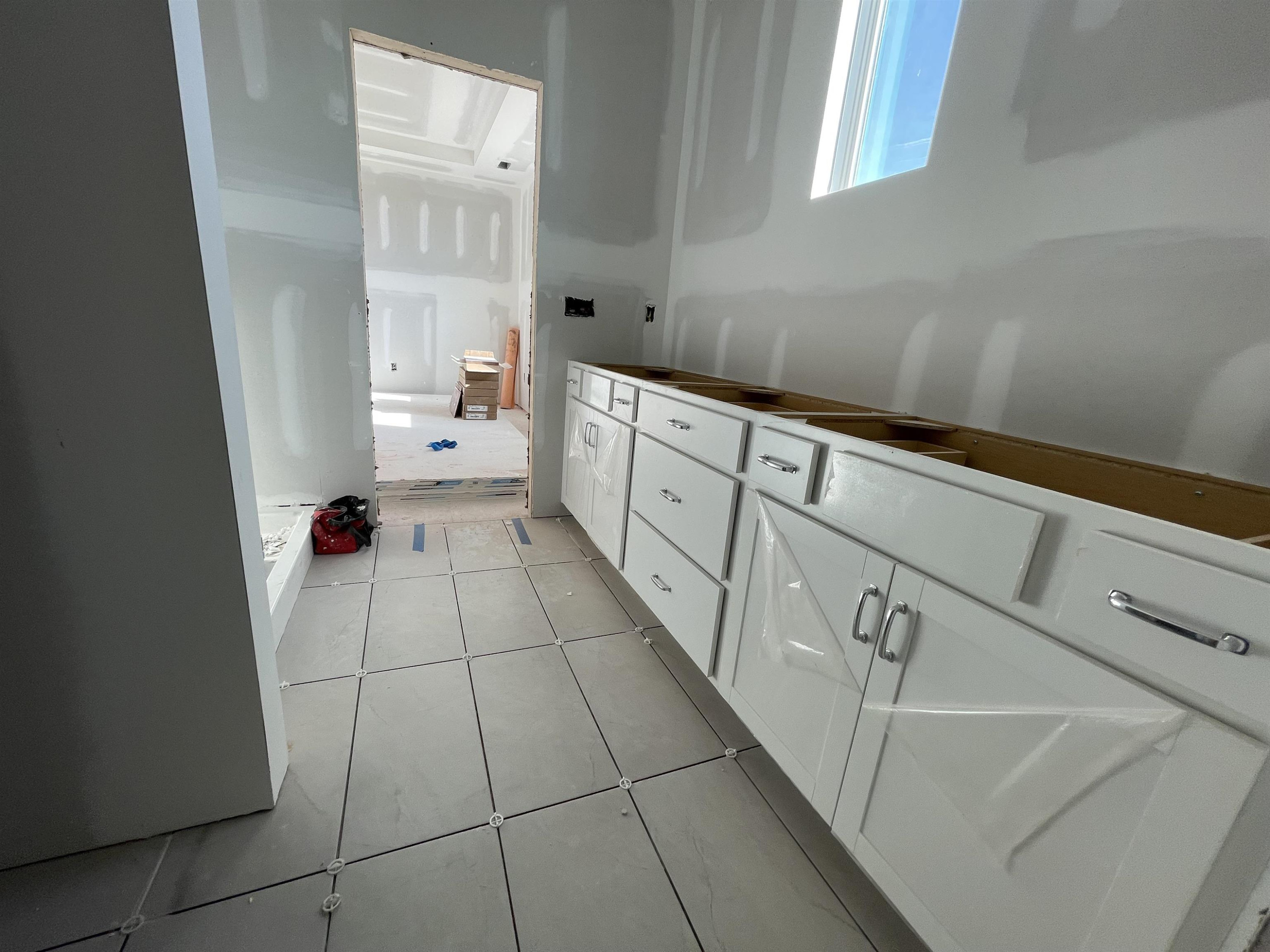 540 Marthas View Way Wake Forest, NC 27587 - Photo 20 of 25 a kitchen with granite countertop white cabinets and white appliances