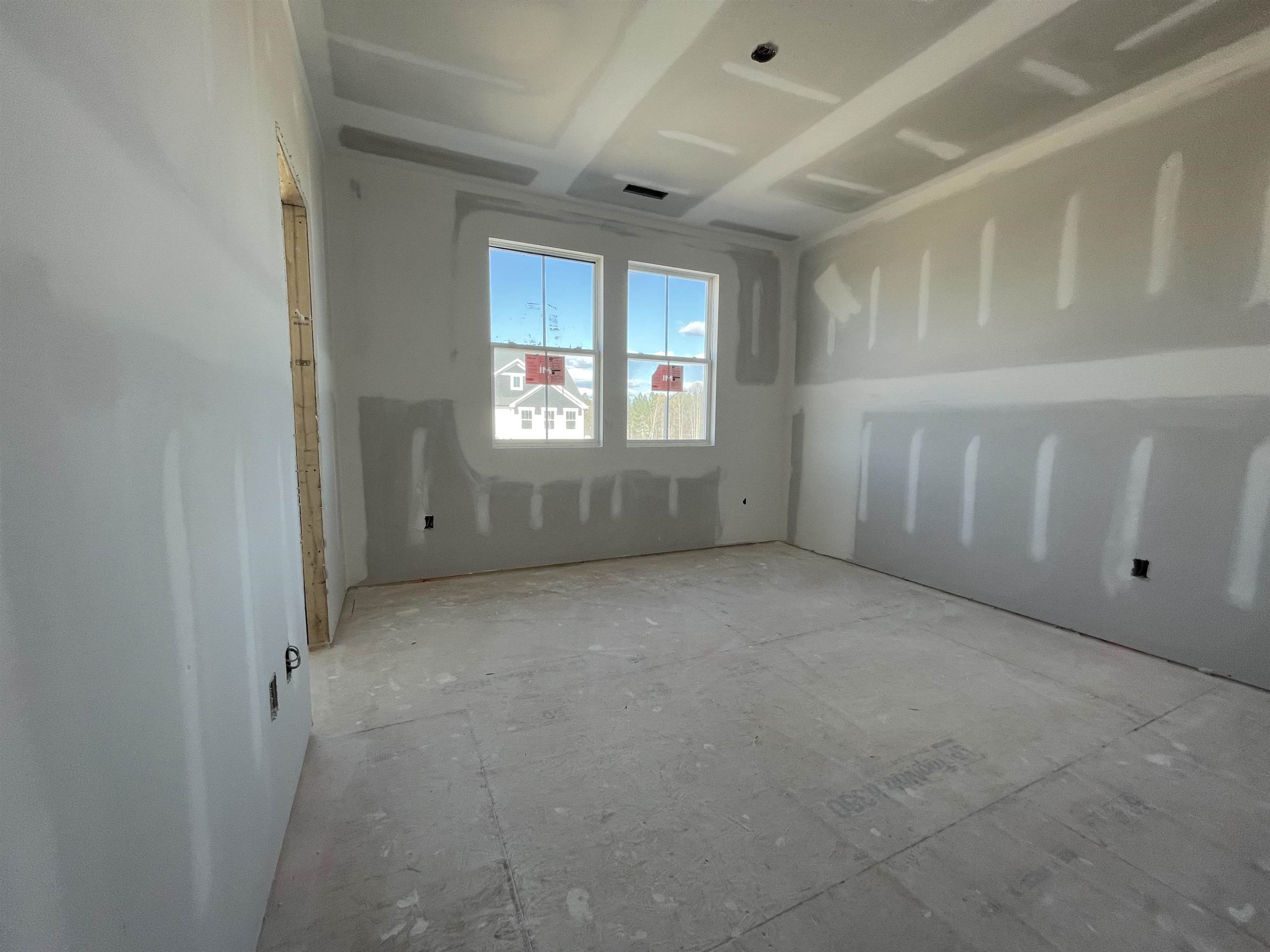540 Marthas View Way Wake Forest, NC 27587 - Photo 23 of 25 an empty room with windows