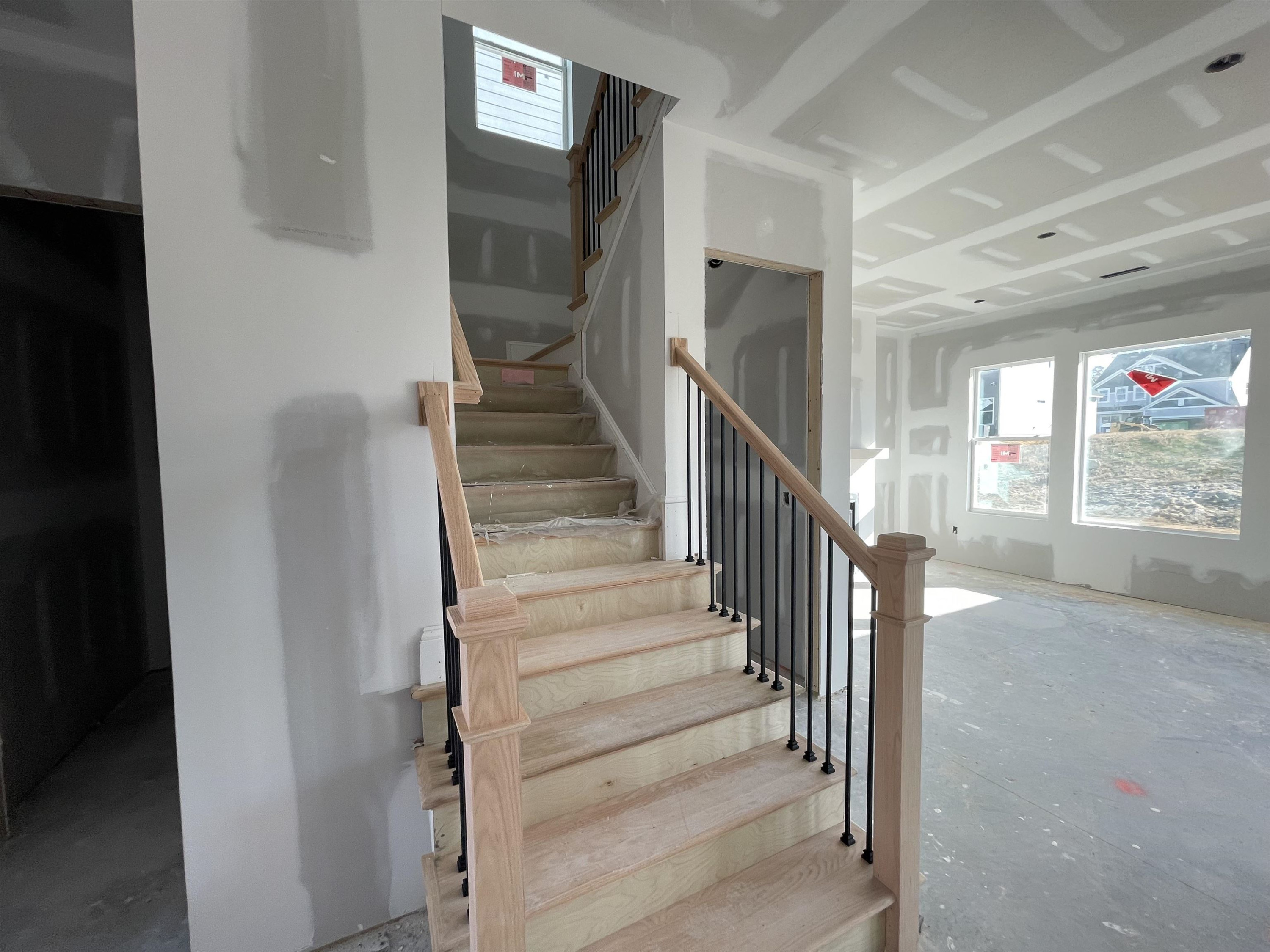 540 Marthas View Way Wake Forest, NC 27587 - Photo 9 of 25 a view of staircase with lots of frames on wall and a window