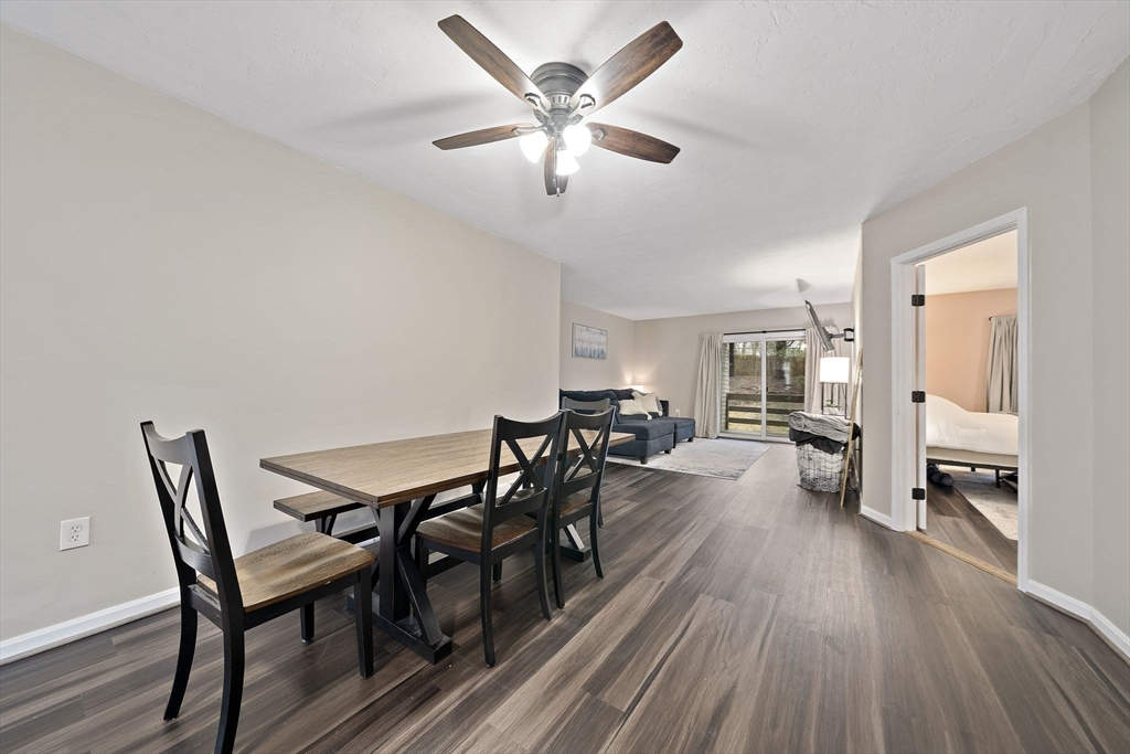 22 Union Square, Unit 22 Randolph, MA 02368 - Photo 12 of 28 a view of a dining room with furniture and wooden floor