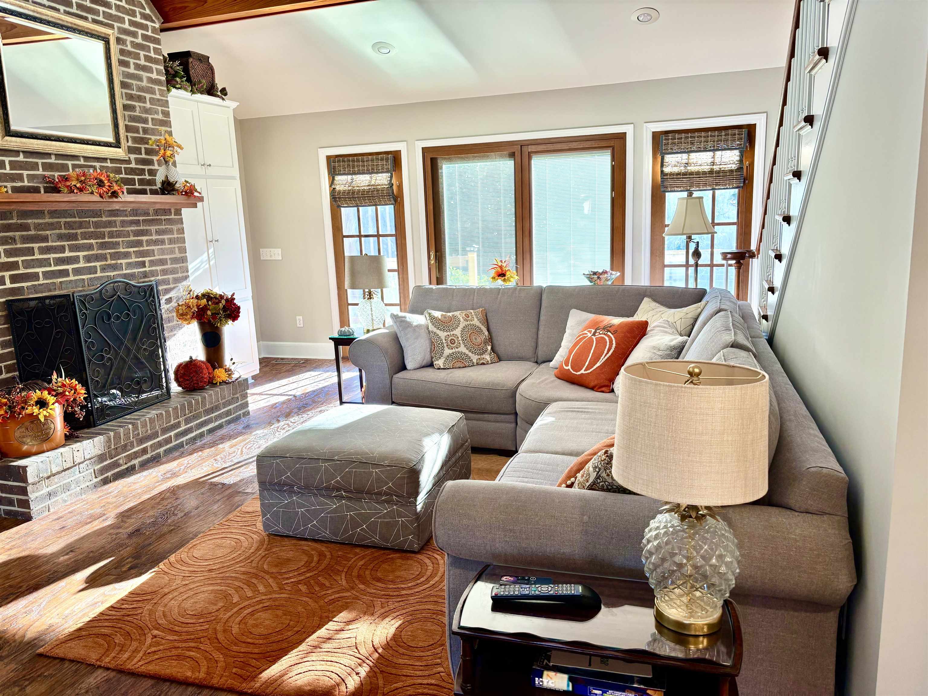 94 John Green Lane Georgetown, SC 29440 - Photo 11 of 35 Living room featuring wood finished floors and a brick fireplace