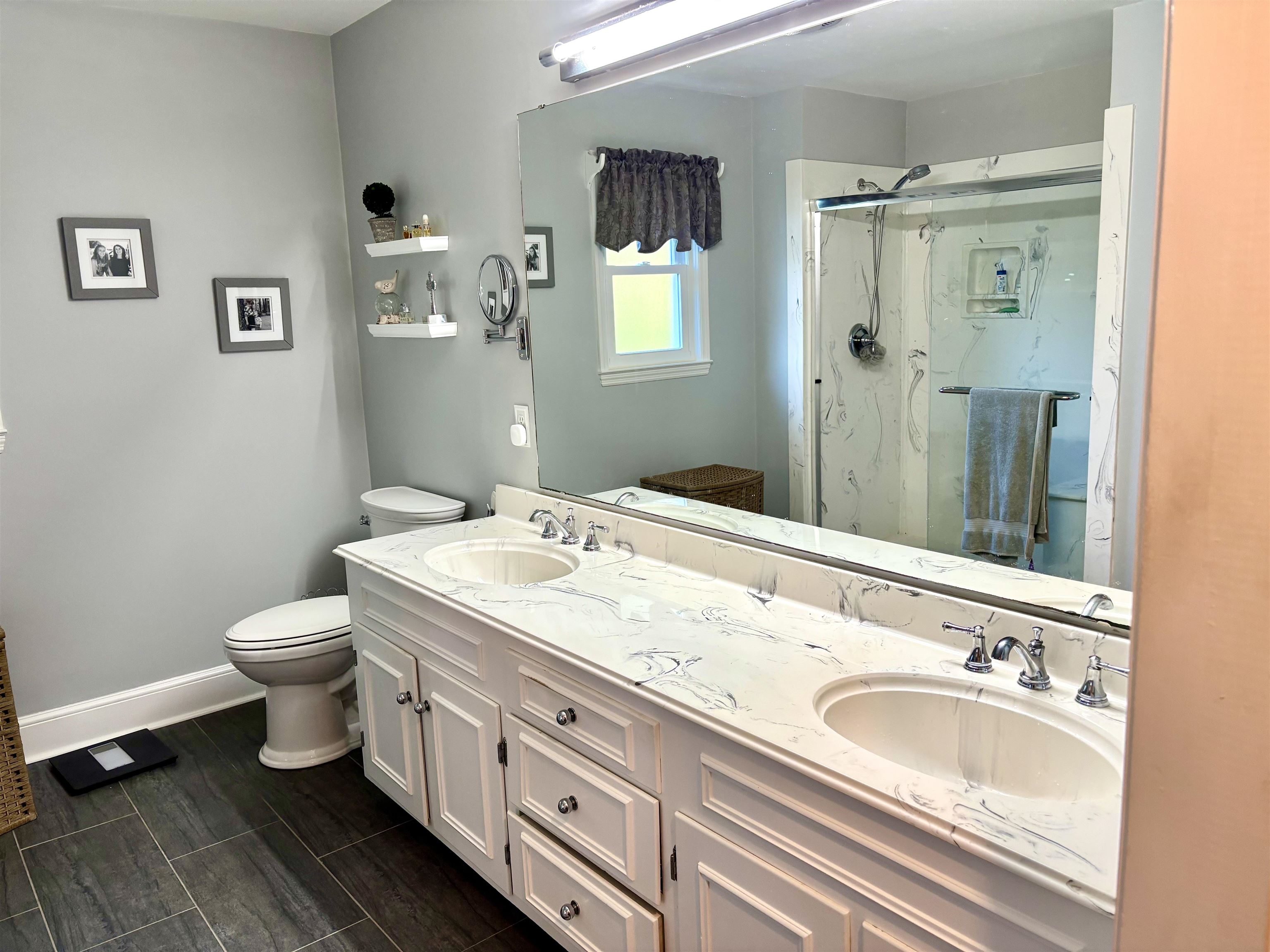 94 John Green Lane Georgetown, SC 29440 - Photo 19 of 35 Bathroom with a marble finish shower, double vanity, and wood tiled floors