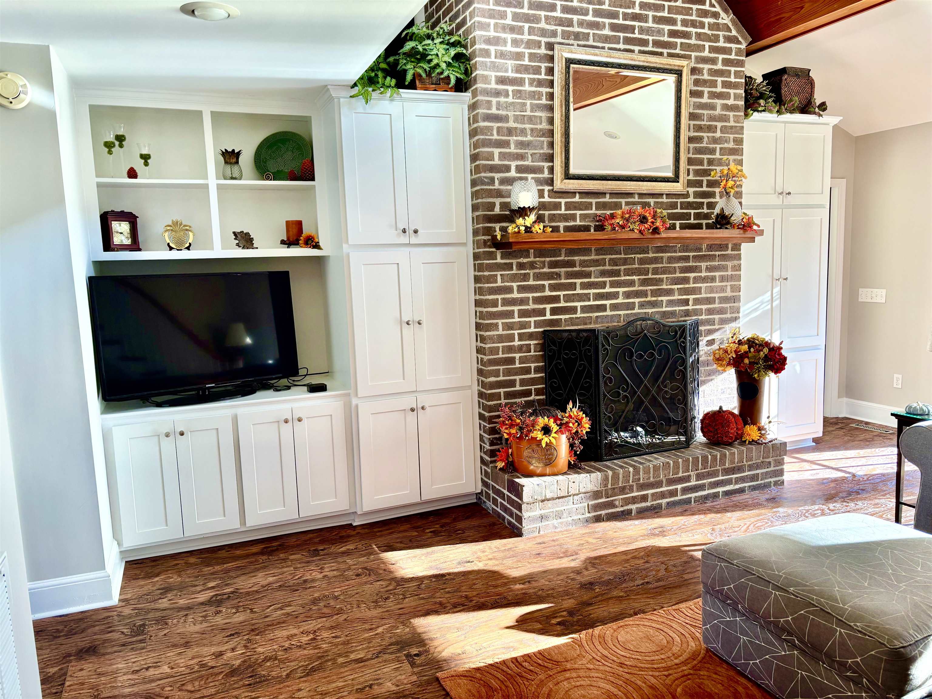 94 John Green Lane Georgetown, SC 29440 - Photo 8 of 35 Living area featuring dark wood finished floors, a fireplace, and lofted ceiling