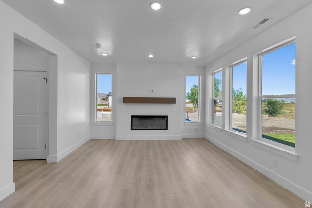 1213 West 500 South Logan, UT 84321 - Photo 5 of 29 Living space featuring light wood-finish flooring, recessed lighting, and white walls